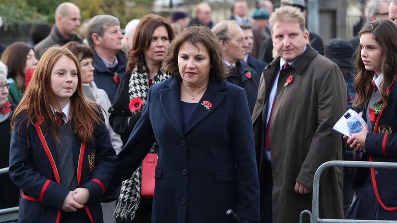 Stella Robinson (centre), whose parents Wesley and Bertha Armstrong were killed in the Enniskillen bombing, attends the unveiling of the new memorial. Photograph: Niall Carson/PA Wire