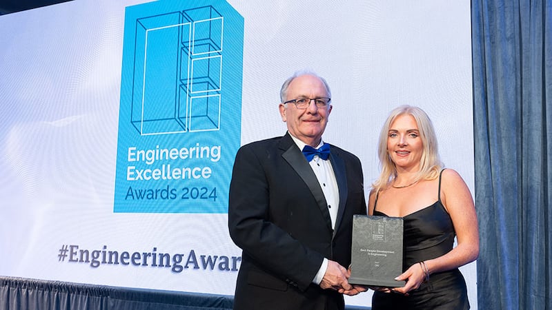 Matt Cotterell, awards judge, presents the best people development in engineering award to Rachel Murray, ORS