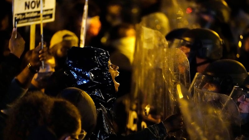 Protesters confront police during a march on Tuesday in Philadelphia.  Photograph: Matt Slocum/AP