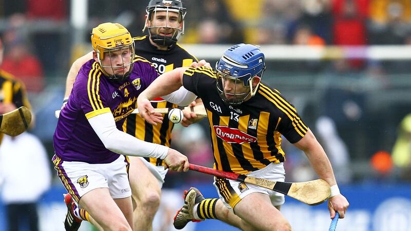 Wexford’s Simon Donohoe tries to dispossess Kilkenny’s Ger  Aylward during the league semi-final at Wexford Park. Photograph: Ken Sutton/Inpho