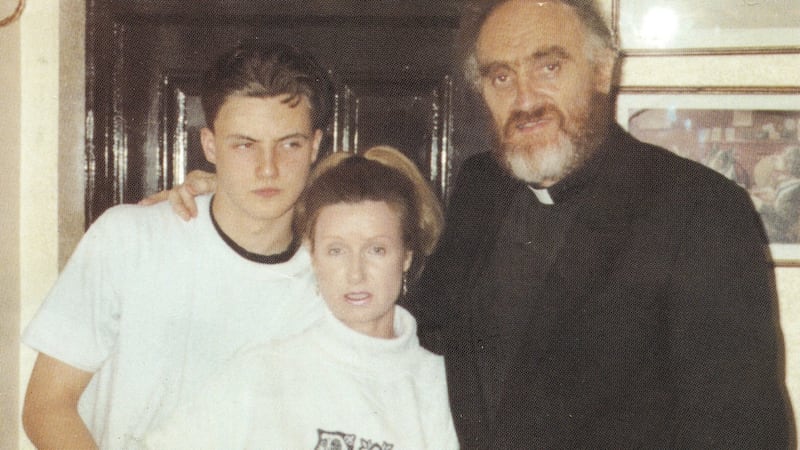 Fr Michael Cleary with Phylis Hamilton and their son Ross