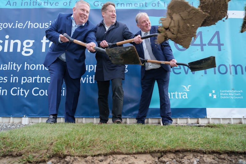 Minister for Housing Darragh O’Brien, centre, turns the sod for part of the O'Devaney Gardens development with Mike Flannery of Bartra Group and Richard Shakespeare of Dublin City Council. Photograph: Barry Cronin