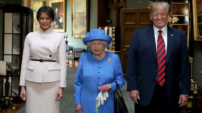 Britain’s Queen Elizabeth stands with US president Donald Trump and his wife Melania in the Grand Corridor during their visit to Windsor Castle on Friday. Photograph:   Steve Parsons/Pool via Reuters