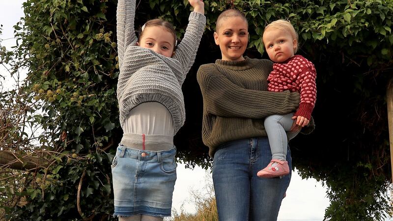 Geraldine Walsh with her children Allegra and Devin: “We can strike a balance between the demands of parenthood, the guilt we are often consumed by and the fact we are not super human.” Photograph: Donall Farmer