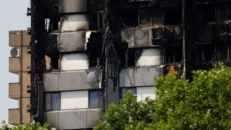 Unburned lower Grenfell Tower block  floors with untouched cladding in place in North Kensington, west London. Photograph: Getty Images