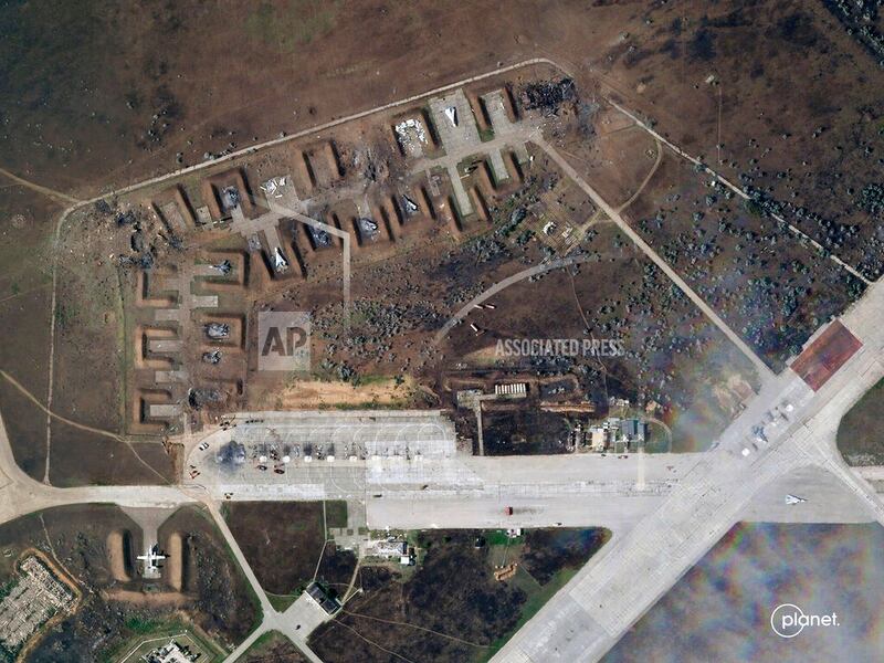 Destroyed Russian aircraft at Saki Air Base after an explosion on August 9th. Photograph: Planet Labs PBC via AP