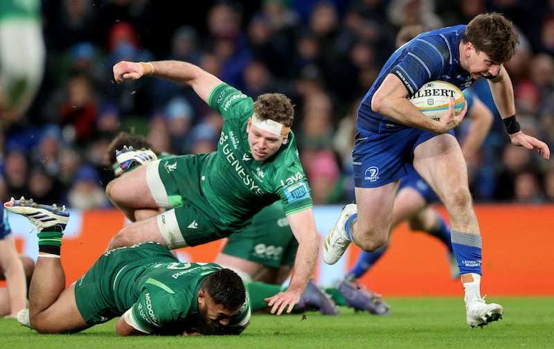 Leinster’s Charlie Tector breaks free from Connacht’s Bundee Aki and Cathal Forde to score a try. Photograph: James Crombie/Inpho