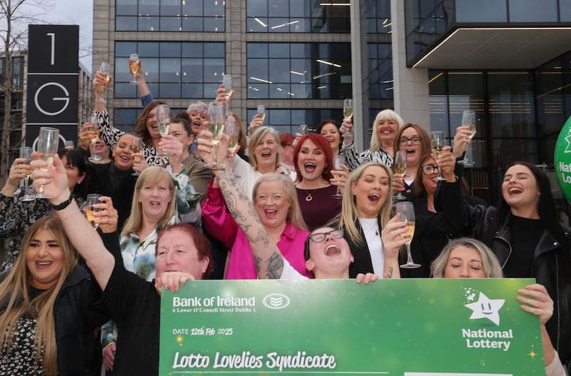 The "Lotto Lovelies" syndicate of Penneys employees celebrate at National Lottery Headquarters in Dublin. Photograph: Alan Betson/The Irish Times
