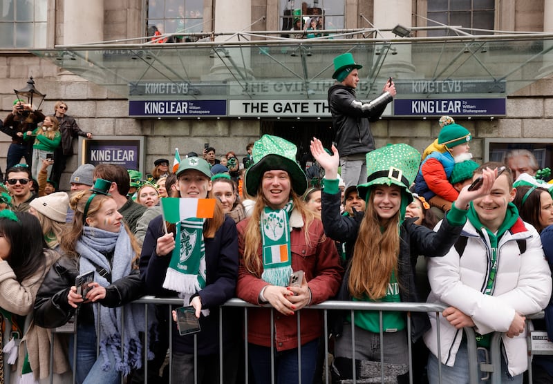 Sightseers enjoy the St Patrick's Day parade as it makes its way through Dublin. Photograph: Alan Betson