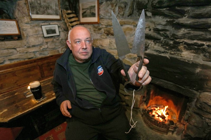 Owner of the Lynotts pub Mick Lynch with the sheep shearers used in The Banshees of Inisherin on the Achill Island, Photograph: Paul Faith/Getty Images