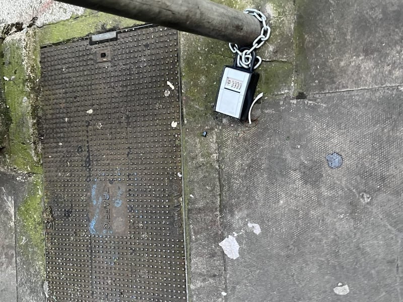 A key lockbox attached to a public pole where it could create a trip hazard, Dublin City Council said. Photograph: Conor Lally