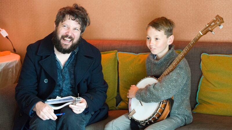 Patrick Freyne chats with banjo player Emmet Daly (12) from Valentia Island, Co. Kerry. Photograph: Daragh Mc Sweeney/Provision