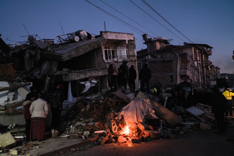 Families sift through rubble searching for bodies, or survivors, in Antakya, Turkey. Photograph: Emily Garthwaite/New York Times