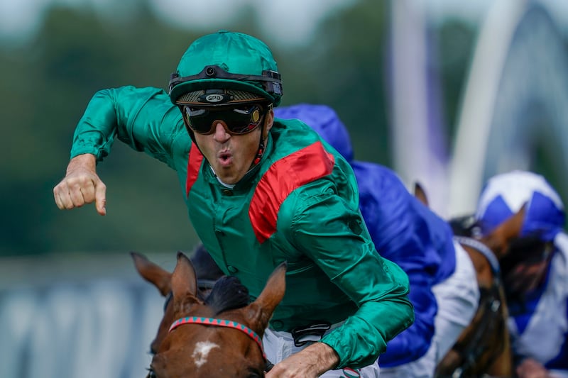 Christophe Soumillon celebrates after riding Vadeni to win The Coral-Eclipse at Sandown Park in Esher, England. Photograph: Alan Crowhurst/Getty Images