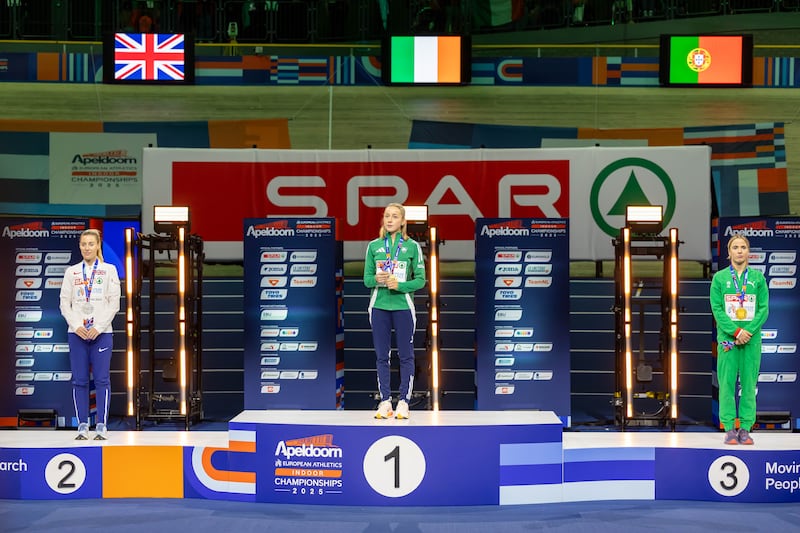 Sarah Healy (centre) during the medal ceremony for the women's 3,000m. Photograph: Morgan Treacy/Inpho