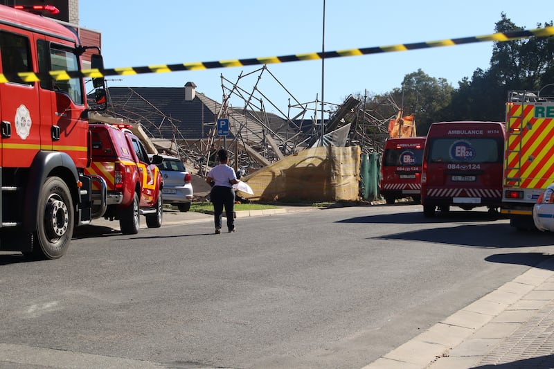 Emergency services try to locate construction workers trapped after a five-storey building collapsed in George, South Africa, on Monday. Photograph: Kirsty Kolberg/EPA-EFE