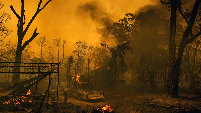 A home burns  in Balmoral, a coastal community in suburban Sydney. Photograph: The New York Times