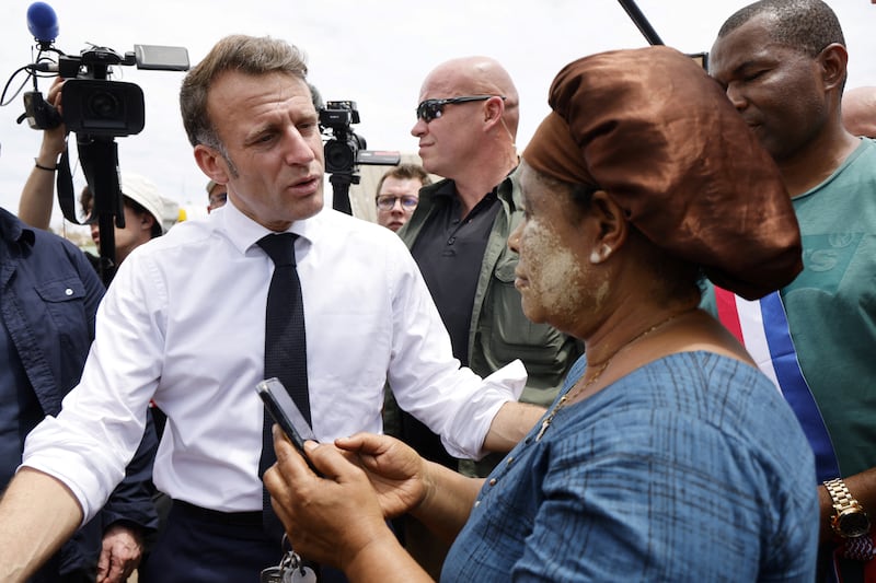 French President Emmanuel Macron speaks to residents in Tsingoni, Mayotte, on Friday, December 20th. Photograph: Ludovic Marin/AFP/Getty