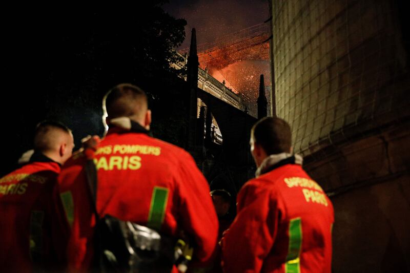 Notre Dame: firefighters at the Paris cathedral on Monday night. Photograph: Geoffroy van der Hasselt/AFP/Getty