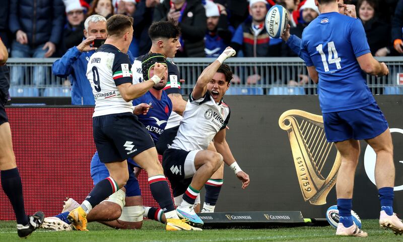 Italy’s Ange Capuozzo celebrates scoring their first try against France. Photograph: Giuseppe Fama/Inpho