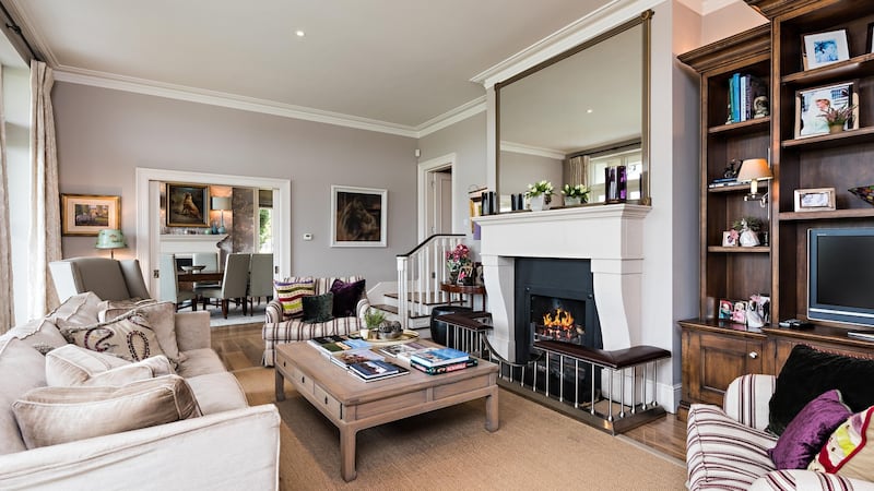 Open fireplaces warm the space, and a trio of French windows open kitchen, lounge and diningroom onto a terrace