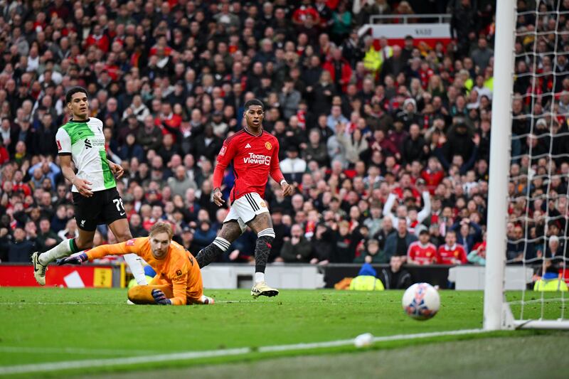 Marcus Rashford of Manchester United shoots and misses as Caoimhin Kelleher of Liverpool looks on. Photograph: Michael Regan/Getty