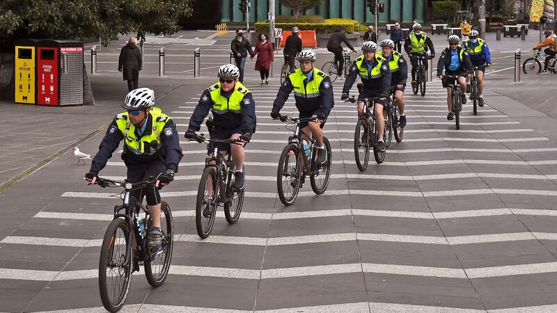 Police officers ride their bikes through the Southbank district of Melbourne on August 12th, 2020. Photograph: William West/AFP/Getty Images