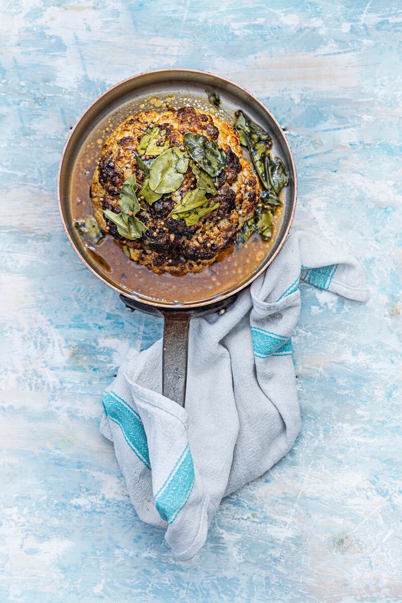 Whole Baked Cauliflower burrito bowl with refried beans and guacamole. Photograph: Harry Weir