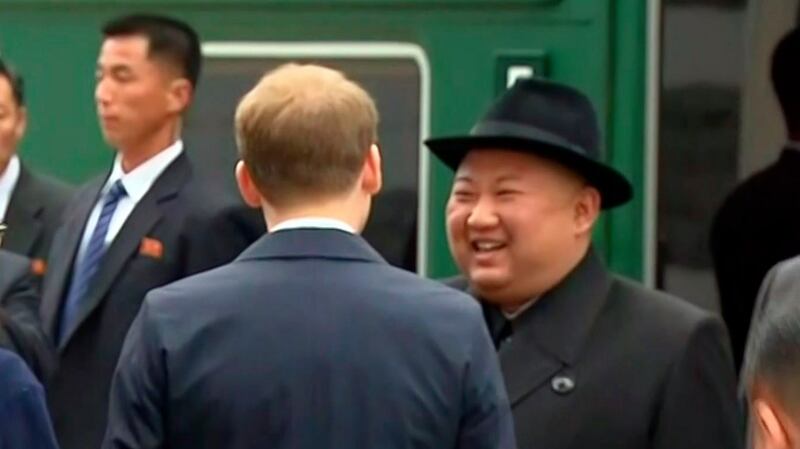 In this image taken from the RU-RTR Russian television, North Korean leader Kim Jong-un smiles as he leaves a train in Vladivostok railway station on Thursday. Photograph: RU-RTR Russian television via AP