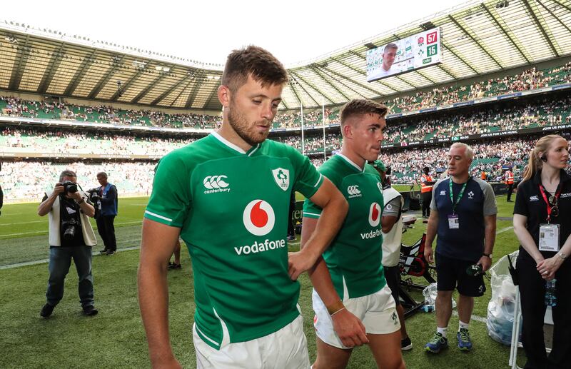 Ireland's Ross Byrne and Garry Ringrose dejected after the defeat to England at Twickenham in 2019. Photograph: Billy Stickland/Inpho 