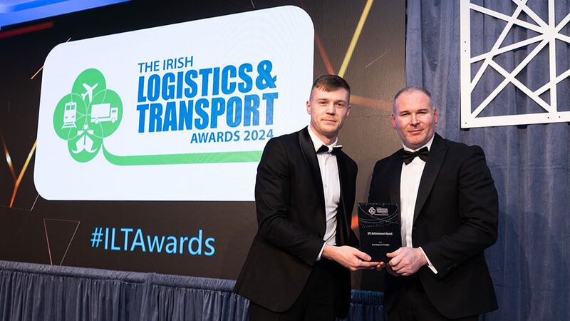 Eduard Tampu, senior recruitment consultant of Driving Force presents the 3PL achievement award to Robert Tumbleton,  Ace Express Freight