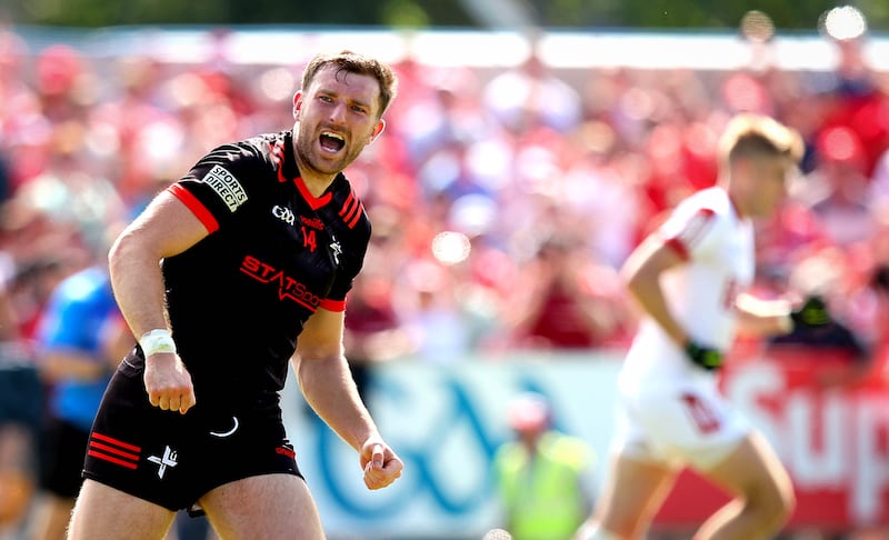 Louth’s Sam Mulroy celebrates scoring a free to put his side into the lead in the last minute. Photograph: Ryan Byrne/Inpho