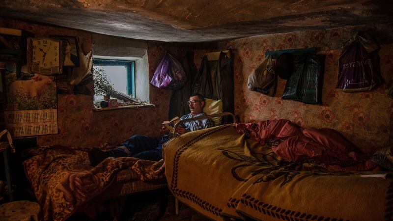 Grisa Muntean, who lives alone in the village of  Dobrusa, Moldova, following the murder of its last two residents. ‘The loneliness kills you.’ Photograph: Laetitia Vancon/The New York Times