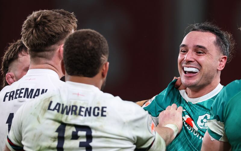 Ireland’s James Lowe sees the funny side as England's Tommy Freeman tries to make a point. Photograph: Billy Stickland/Inpho