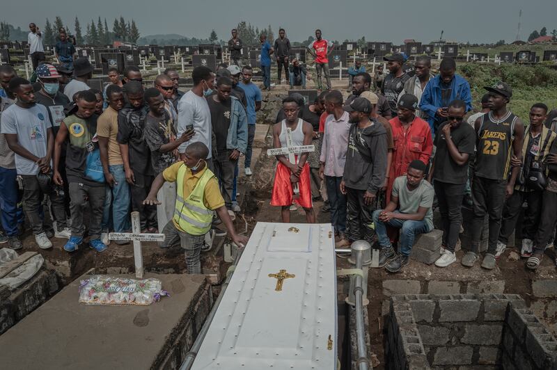 Mourners attend the funeral of Jean de Dieu Balezi, the celebrated boxer known as Kibomango, in Goma on Wedesday. Photograph: Guerchom Ndebo/New York Times
                      