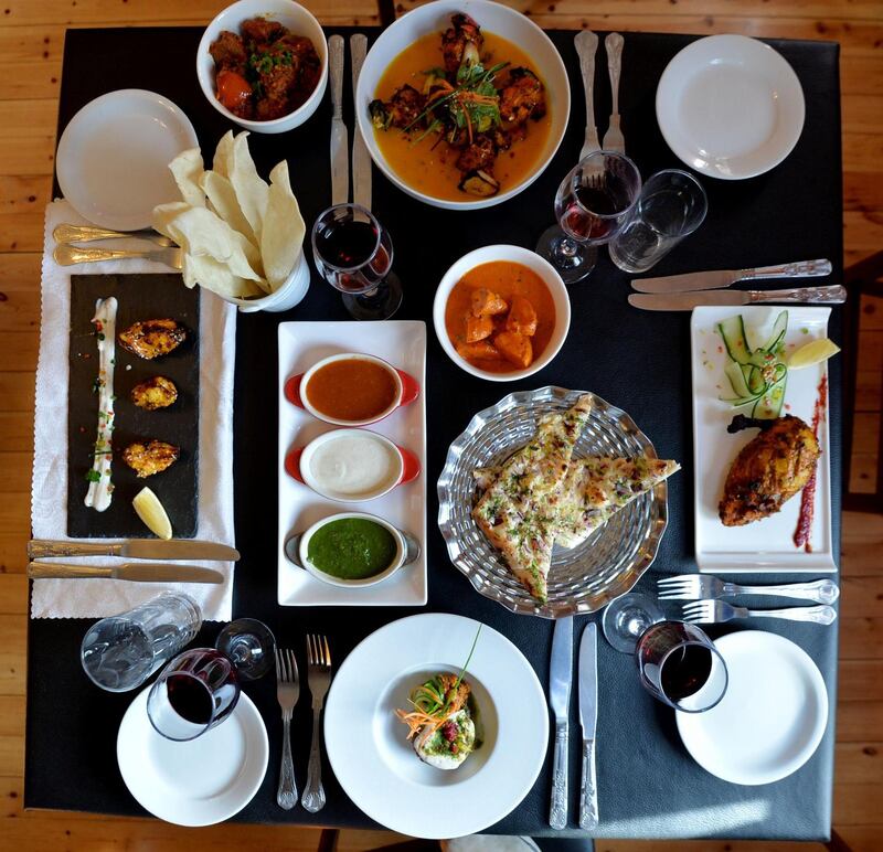 Dishes from Sanjay’s Kitchen (anti-clockwise from bottom): Potato Cake with Mint Chutney and Yogurt Mint Sauce, Tandoori Chicken, Monkfish in Mango Sauce, Lamb Bhuna, Sesame Chicken Tikka and (Centre) Garlic, Onion and Coriander Naan Bread, Papadums with Mango, Yogurt and Mint Dips, and Sesame Chicken Tikka. Photograph: Alan Betson