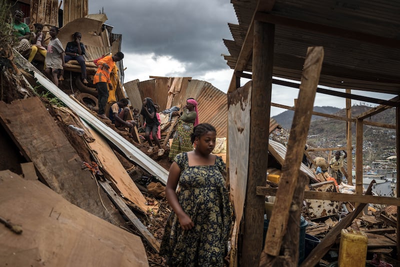 Cyclone Chido: Residents survey homes destroyed near Mamoudzou. Photograph: Sergey Ponomarev/The New York Times