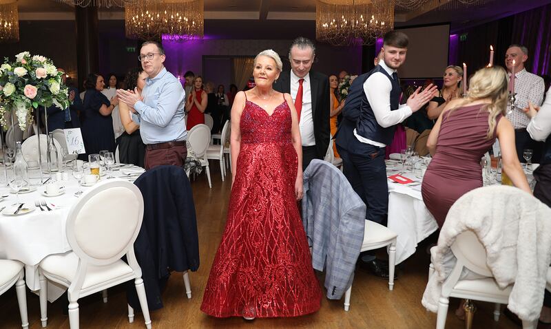 Marilyn O'Connor is applauded as she arrives into the Dance While You Can fundraiser for MND at the Cavan Crystal. Photograph: Lorraine Teevan