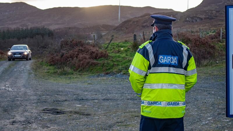 A Garda standing at the entrance to the Windmill site near Kerrykeel in North Donegal, where the search  is being undertaken. Photograph: North West Newspix