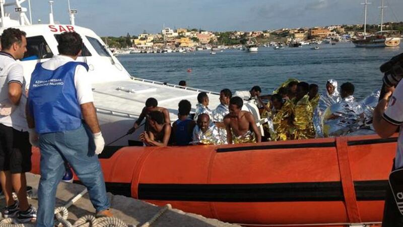 Rescued migrants arrive onboard a coastguard vessel at the harbour of Lampedusa this morning. Photograph: Nino Randazzo/ASP/Reuters