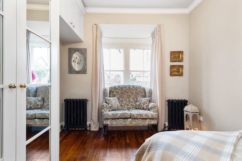 The main bedroom has a bay window