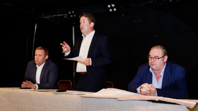 Darragh O’Brien  with  Eoghan O’Brien, left, and Tom O’Connor of the National Bus and Rail Union (NBRU), at a public meeting in Portmarnock. Photograph: Cyril Byrne / THE IRISH TIMES