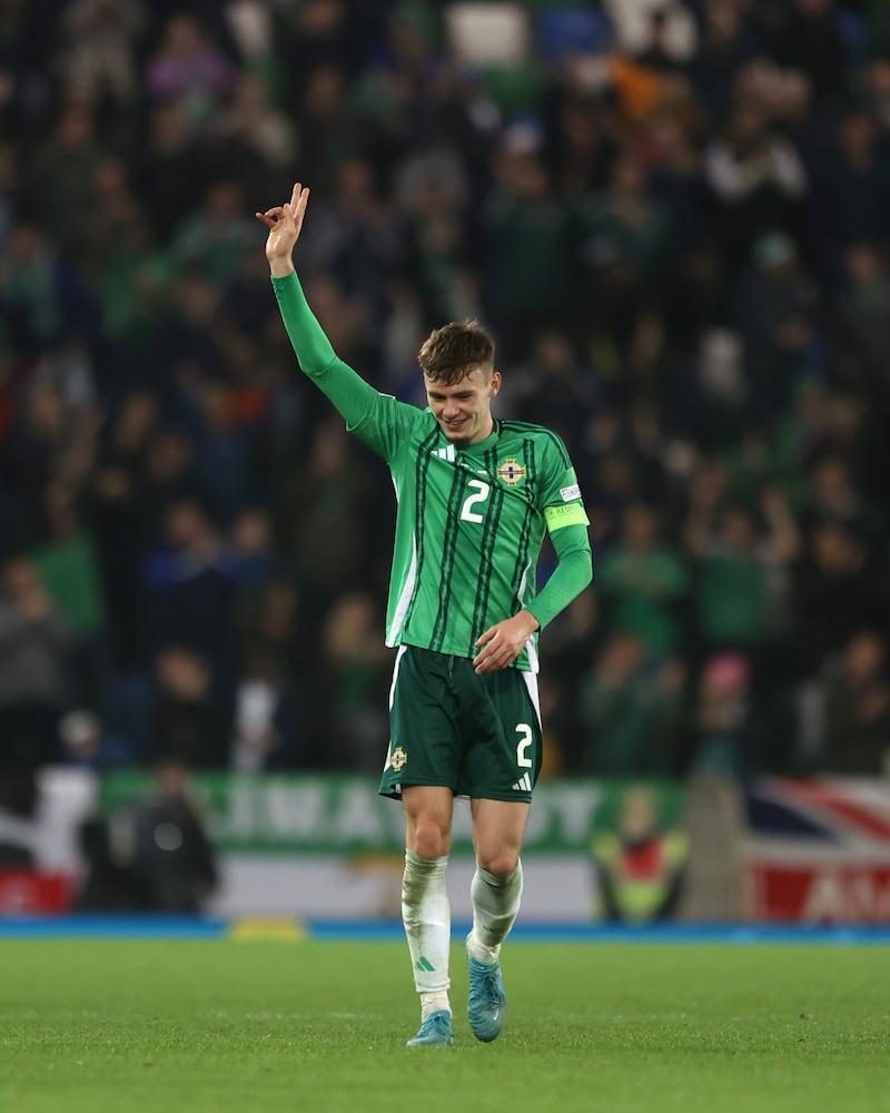 Northern Ireland captain Conor Bradley salutes the fans following the win over Bulgaria at Windsor Park. Photograph: Liam McBurney/PA Wire