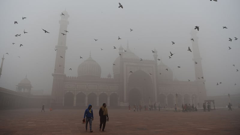 Visitors walk through the courtyard of Jama Masjid amid heavy smog in the old quarters of New Delhi on November 8th, 2017. Photograph: Sajjad Hussain/AFP/Getty Images