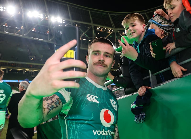 Ireland's Mack Hansen takes a selfie with fans after the game. Photograph: Billy Stickland/Inpho