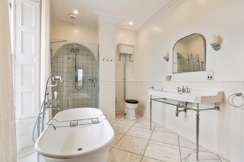 The main bathroom is pure Victorian elegance, with high-quality white sanitary ware, a bath with shower attachment and a large shower with Burlington fittings.