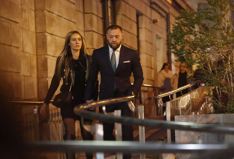 Conor McGregor leaving the Four Courts in Dublin with his partner Dee Devlin after the civil case taken by Nikita Hand. Photograph: Alan Betson
