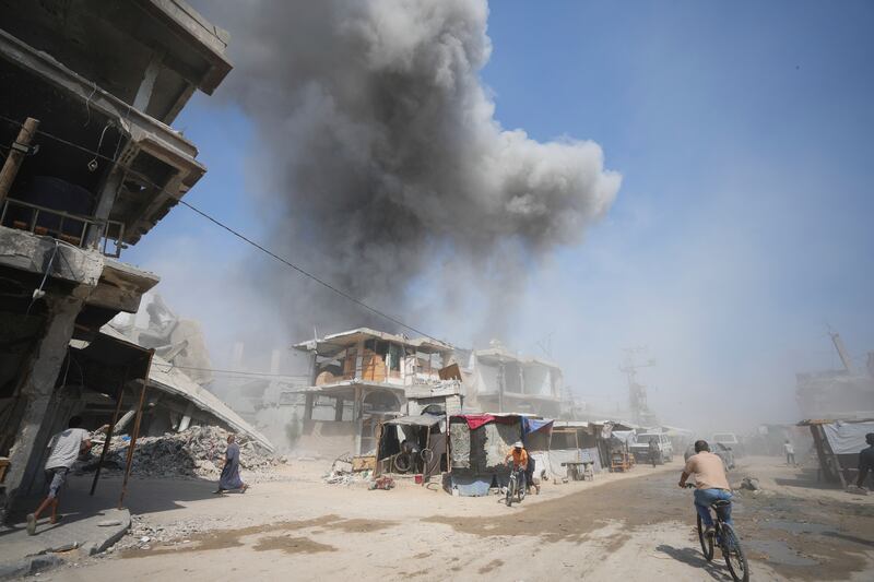 Smoke rises following Israeli bombardments in Khan Younis. Photograph: Abdel Kareem Hana/AP