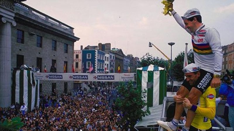 King of the world: Roche on the shoulders of his great rival Sean Kelly at the 1987 Nissan Classic in Dublin after he became world champion