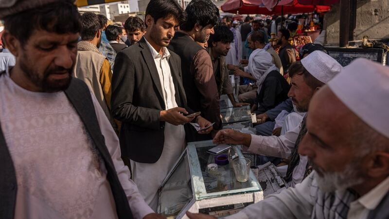 Money changers do business in Kabul on  August 21st. Photograph: Victor J Blue/New York Times